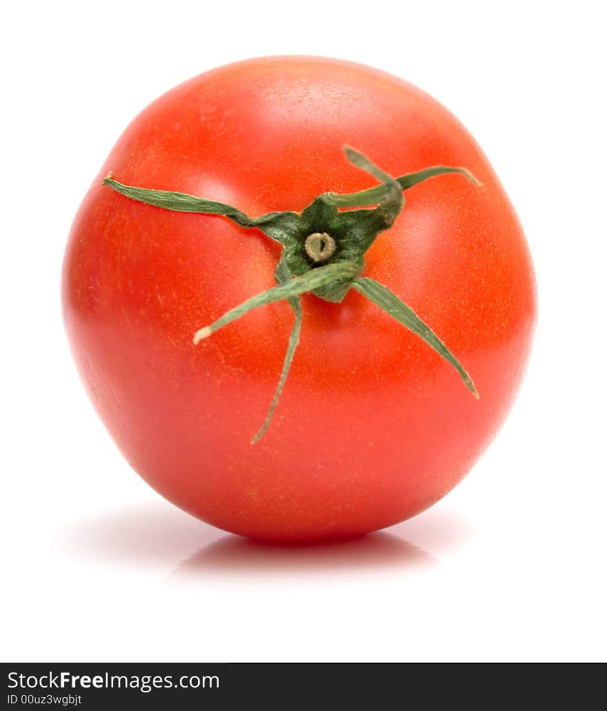 Perfect tomato on the white. Full isolation, shallow DOF.