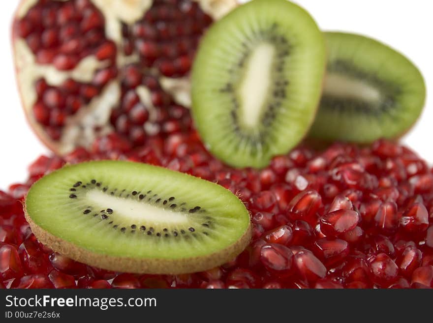 Pomegranates and kiwi isolated on white background. Pomegranates and kiwi isolated on white background