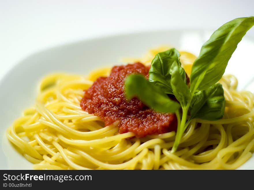 Spaghetti pasta with tomato sauce and basil. Spaghetti pasta with tomato sauce and basil