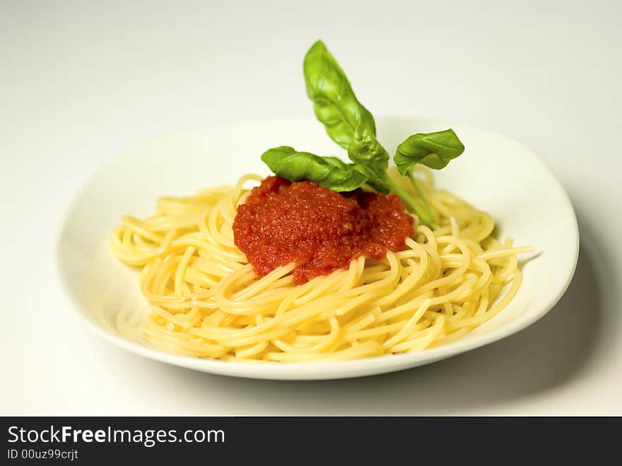 Spaghetti pasta with tomato sauce and basil. Spaghetti pasta with tomato sauce and basil