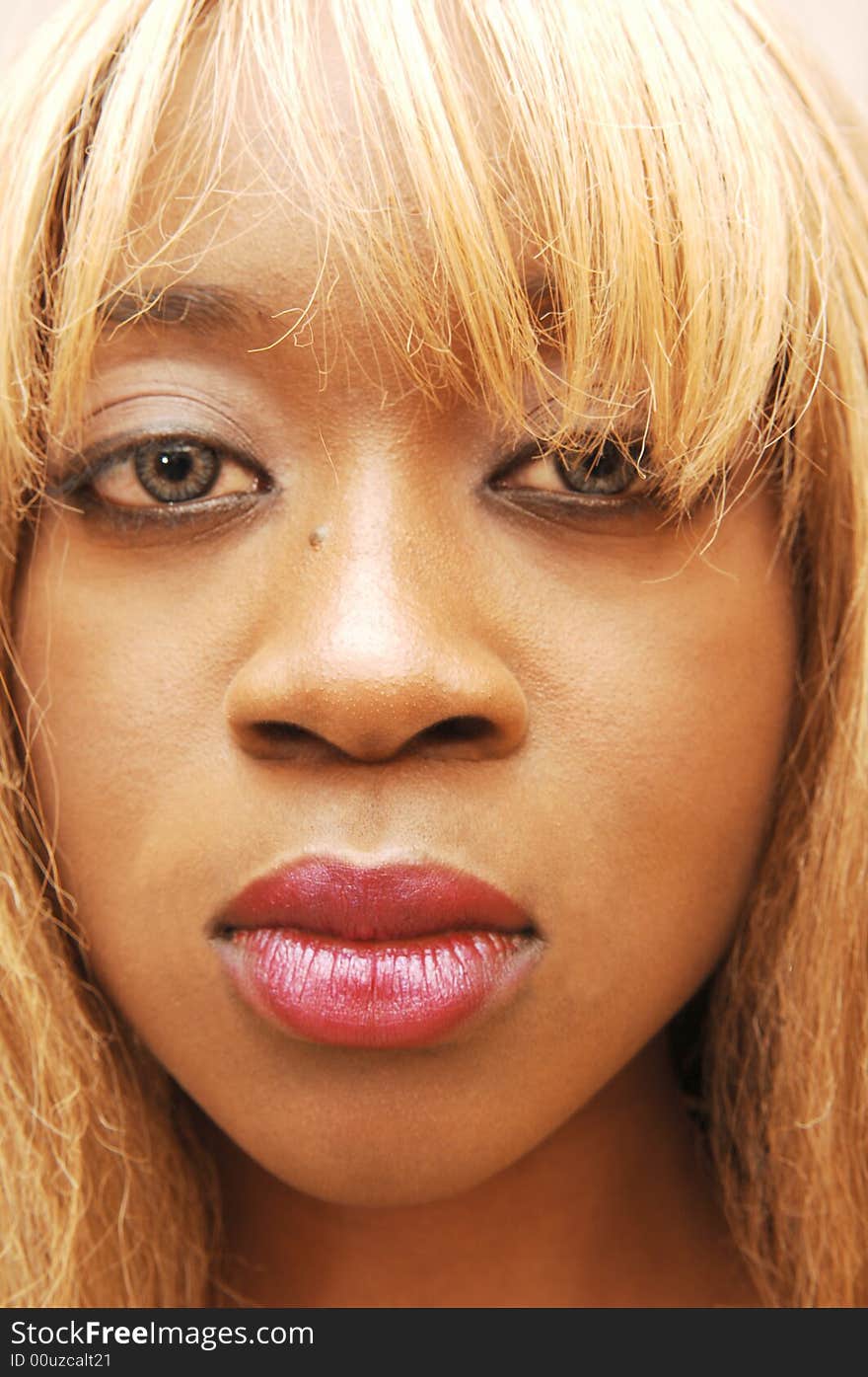 The portrait of an young blond Jamaican girl in close up with blond hair
and big red lips. The portrait of an young blond Jamaican girl in close up with blond hair
and big red lips.