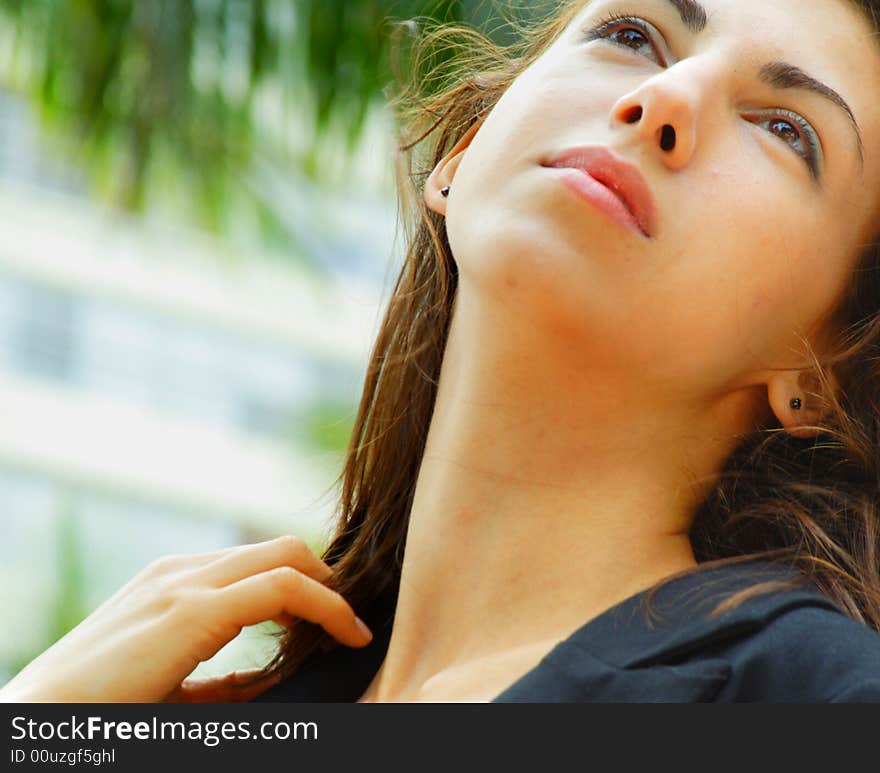 Attractive woman tilting back her head. Attractive woman tilting back her head