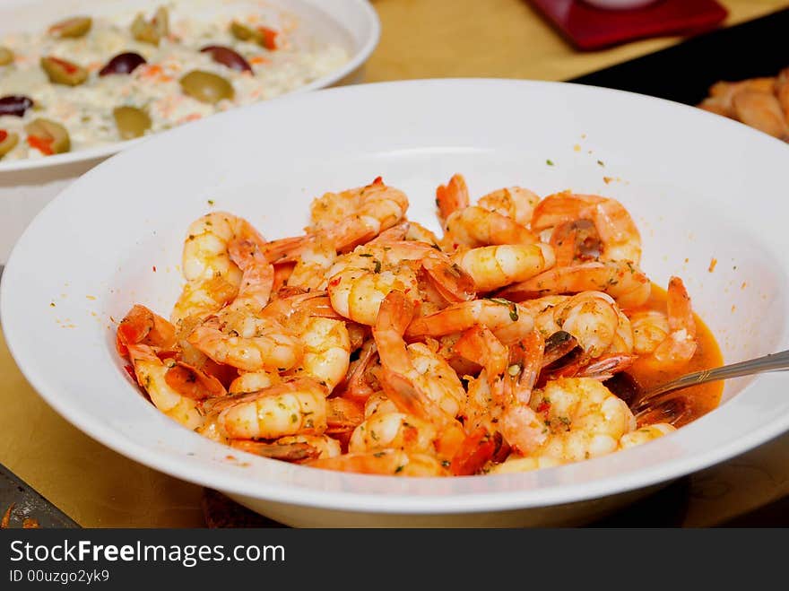 A full plate of shrimp and potatoes salad. A full plate of shrimp and potatoes salad