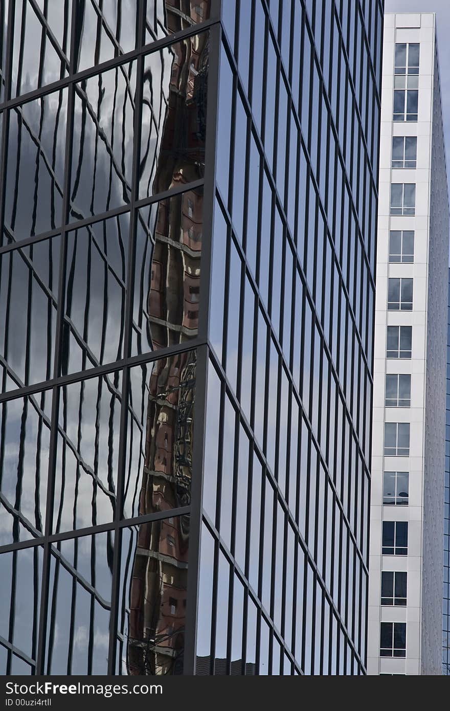 Glass modern office buildings with reflection in a modern downtown