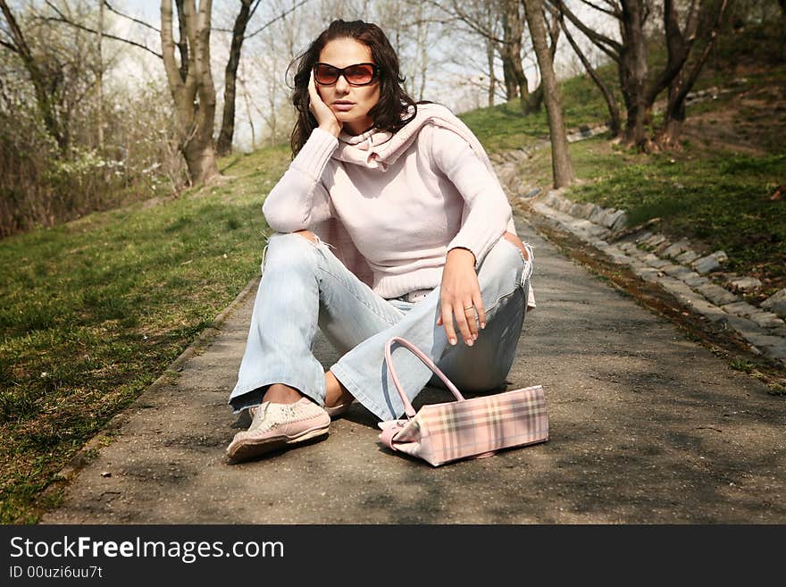 Attractive woman relaxing in the park. Attractive woman relaxing in the park