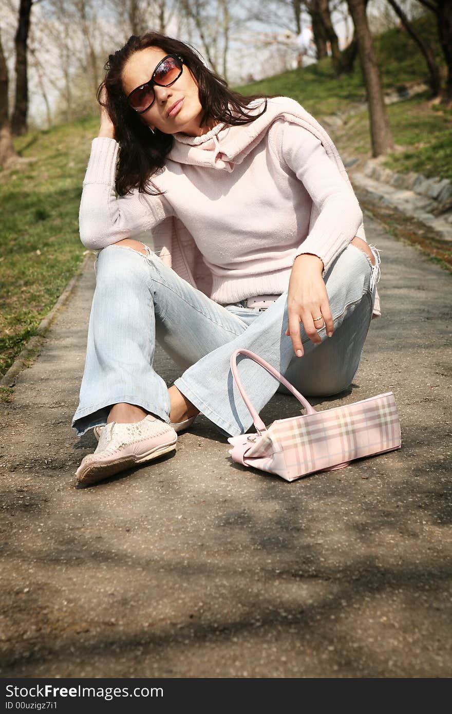 Attractive woman relaxing in the park. Attractive woman relaxing in the park