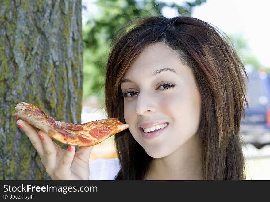 Girl eating pizza