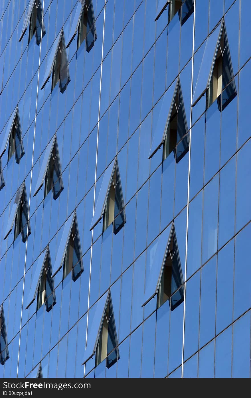 Modern skyscraper window reflections, vertical, close-up