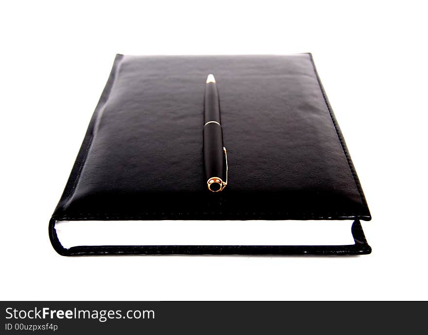 Black material notebook with pen.