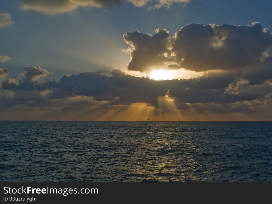 Sailboats against a sunset