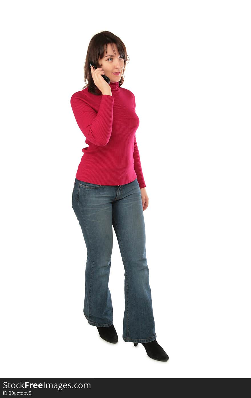 Young woman with cellphone posing on white