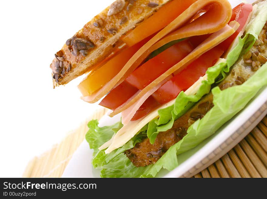 Ham salad sandwich on a plain background