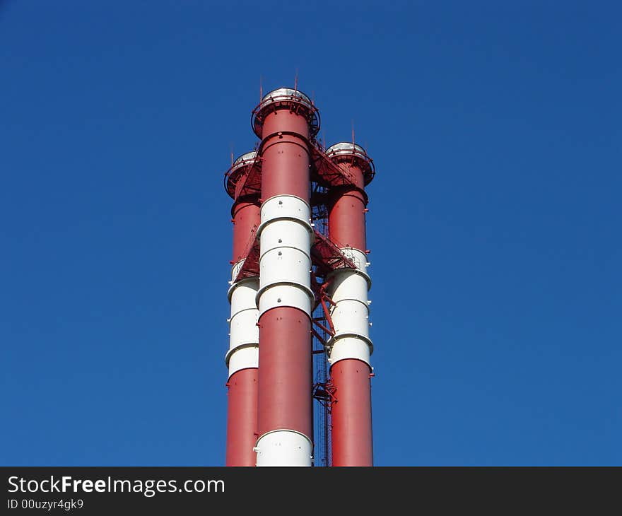 Chimneys on a background of the blue sky