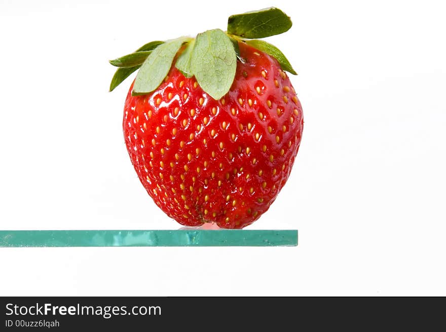 Macro of strawberry standing on glass. Macro of strawberry standing on glass