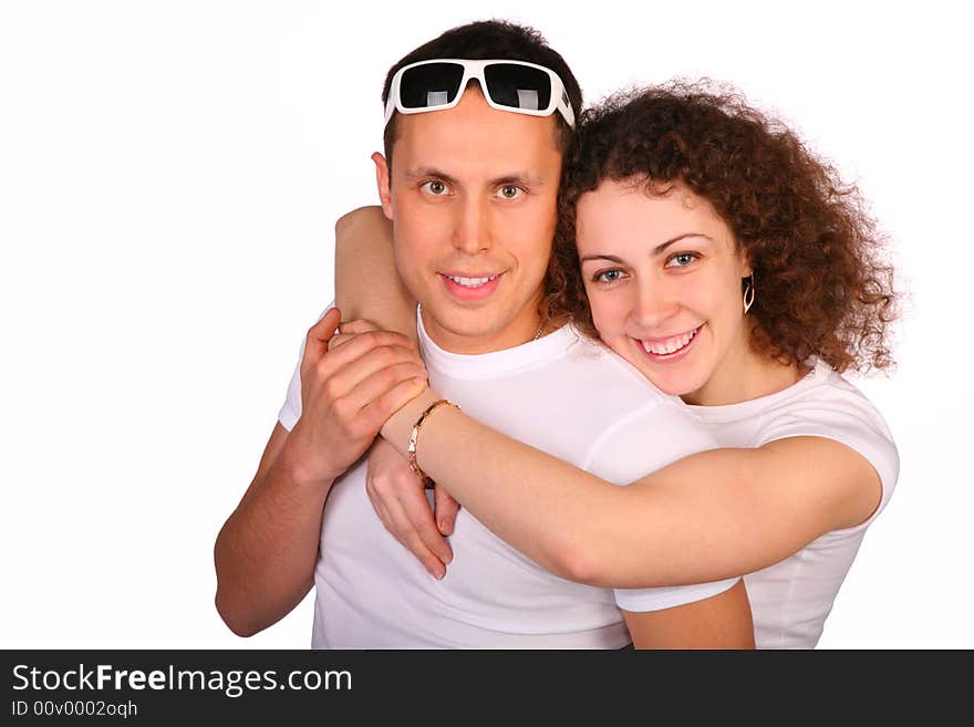 Girl embraces young man from behind. Girl embraces young man from behind