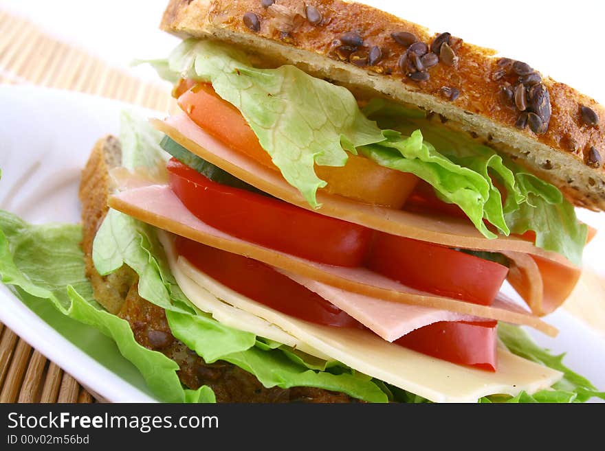 Ham salad sandwich on a plain background