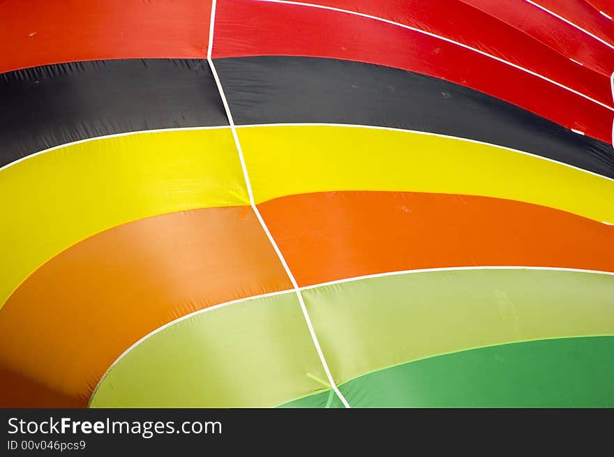 Lots of colors coming together at the top of the hot air ballon. Lots of colors coming together at the top of the hot air ballon