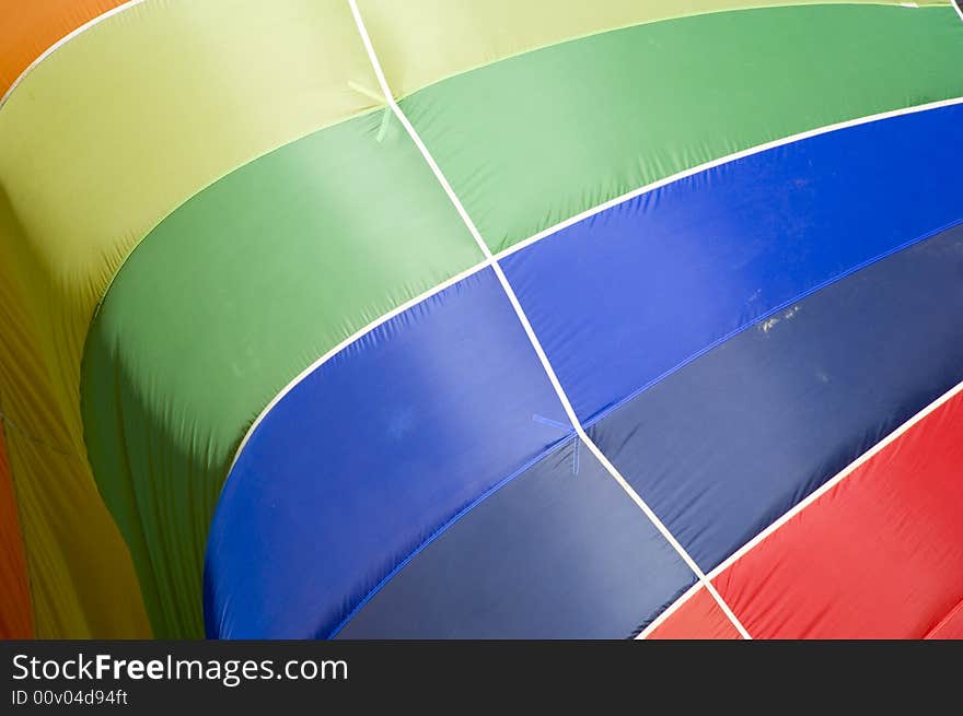 Lots of colors coming together at the top of the hot air ballon. Lots of colors coming together at the top of the hot air ballon