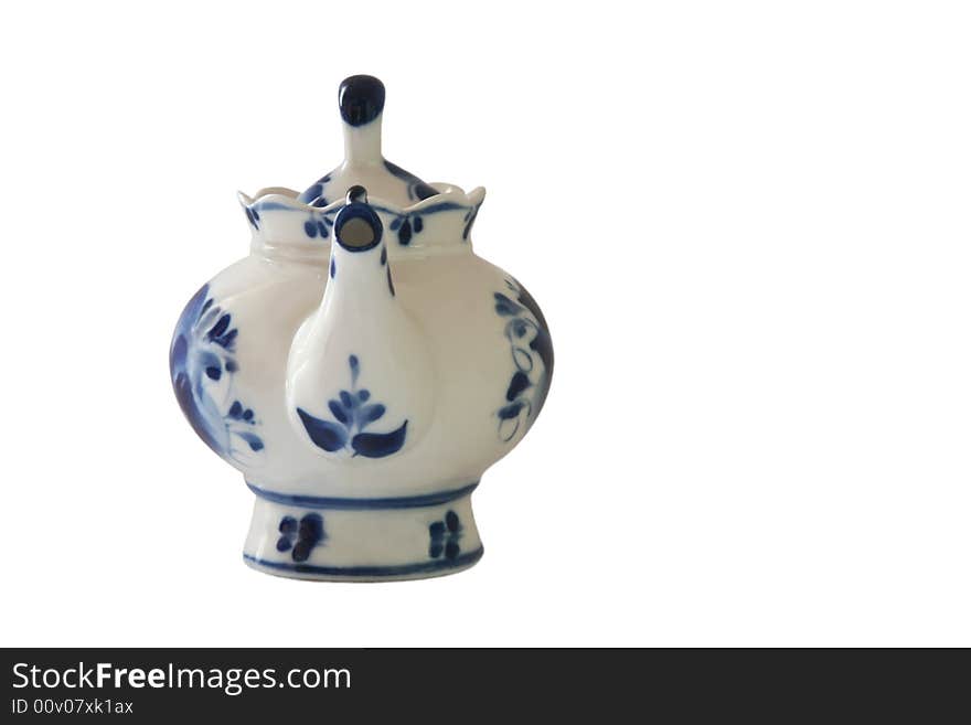 Teapot with blue ornaments.