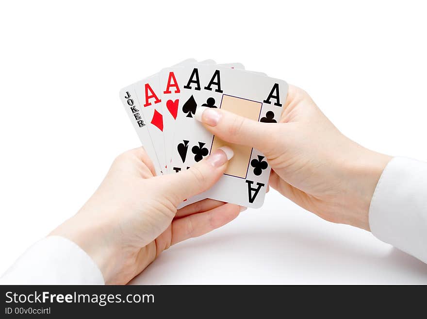 Woman hands holding playing cards with four aces and a jocker combination. Woman hands holding playing cards with four aces and a jocker combination