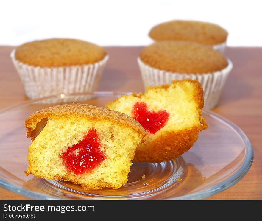 Sweet cakes on the table on transparent plate