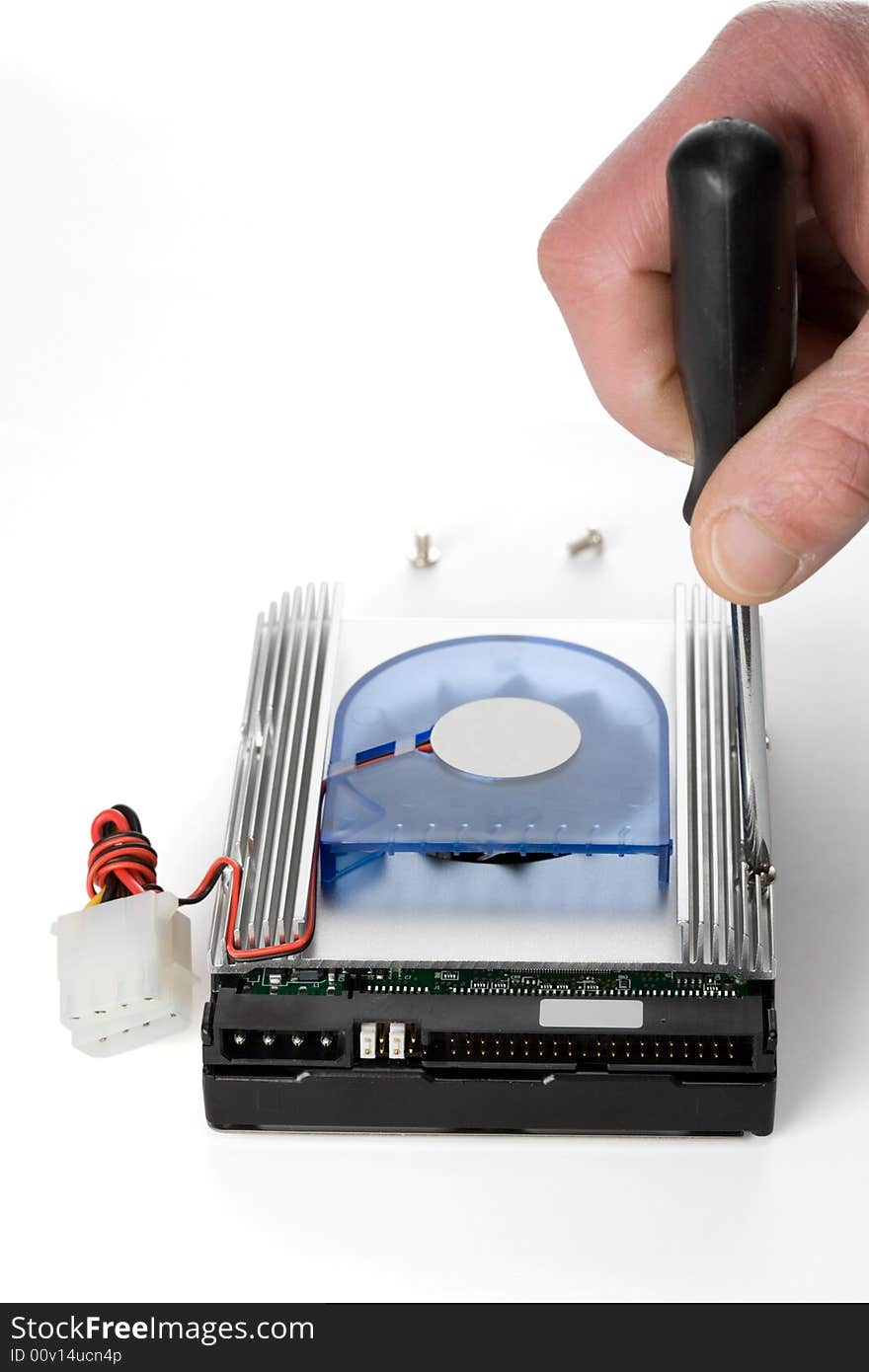 Installing a aluminum cooler on a hard drive. Installing a aluminum cooler on a hard drive.