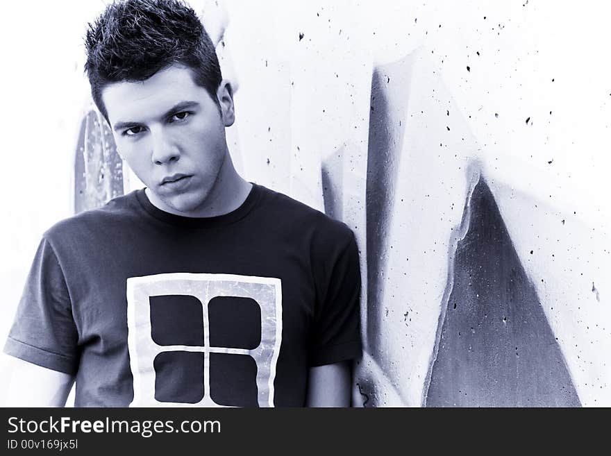 Young man portrait over grafted wall. Young man portrait over grafted wall.