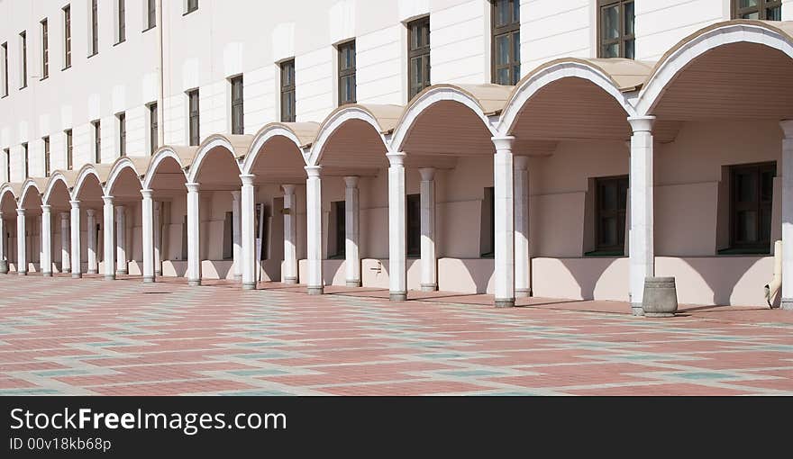 Arches leaving in distance and parquet floor