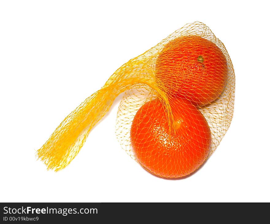 2 oranges fruits are laying in the yellow nylon string bag, it's standard bag in the shops for packaging various fruits. Subject is isolated on white background. 2 oranges fruits are laying in the yellow nylon string bag, it's standard bag in the shops for packaging various fruits. Subject is isolated on white background.