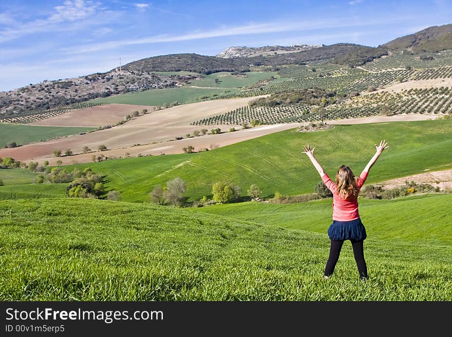 Young woman with raised arms