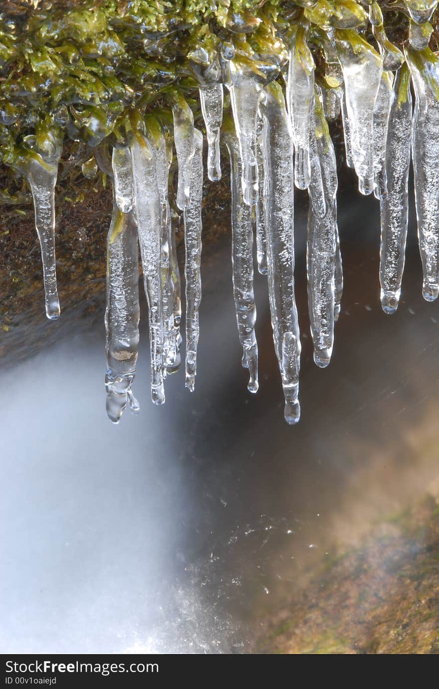 River icicles capture the sunlight in Yosemite National park during winter months