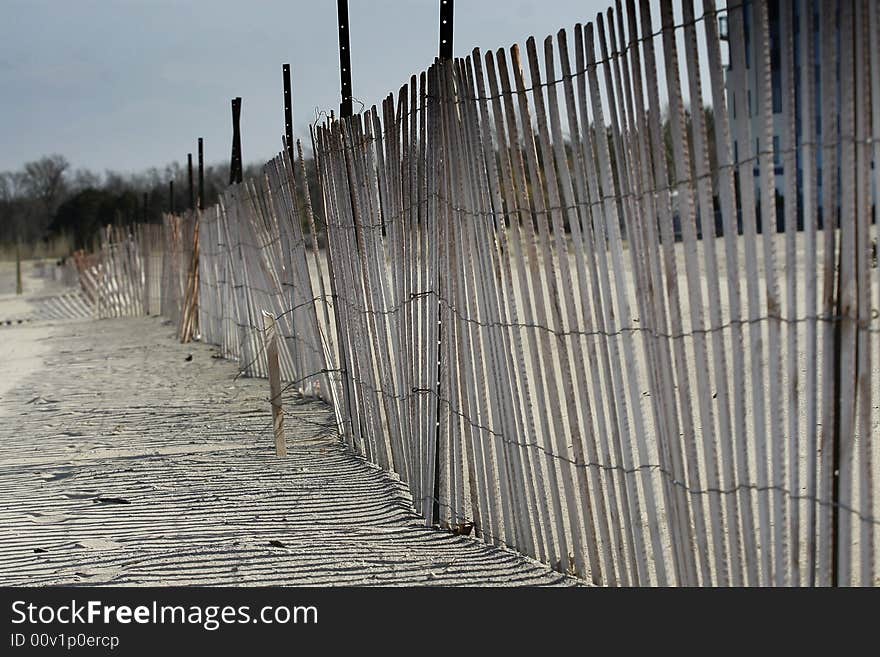 A beach fence along a Canadian lake.