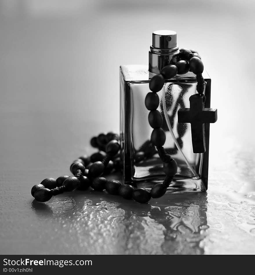 Cologne bottle and rosary