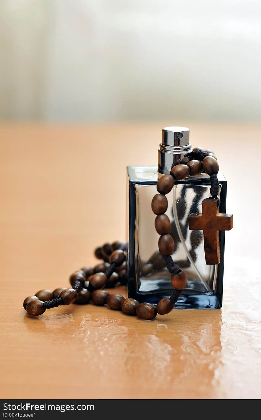 Cologne Bottle And Rosary