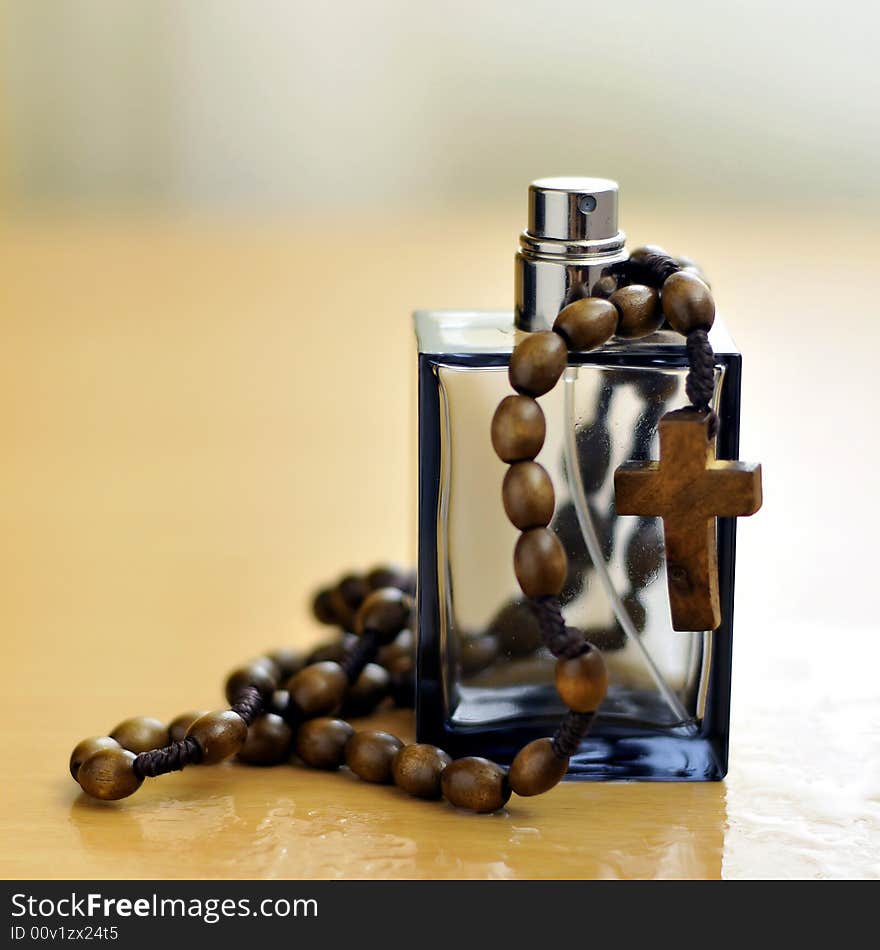 Cologne bottle and rosary