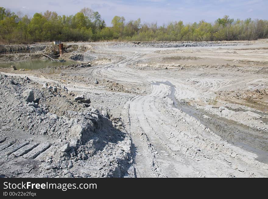 Huge opencast mine for digging the gault with the lake in the middle