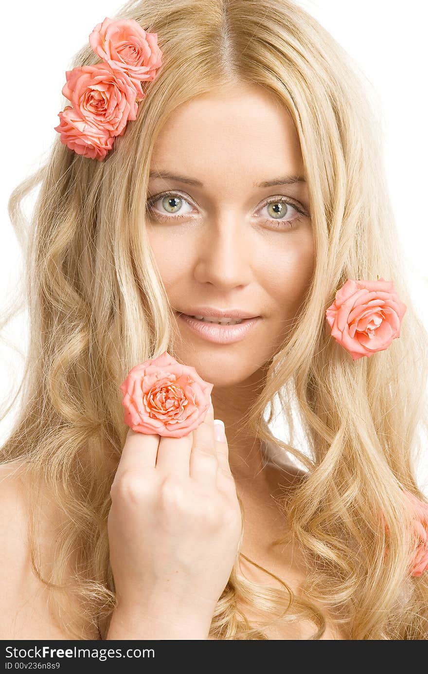 The portrait of a beautiful blond lady with pink roses on a white background. The portrait of a beautiful blond lady with pink roses on a white background