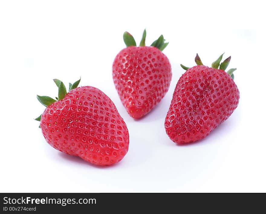 Three strawberrys on white background