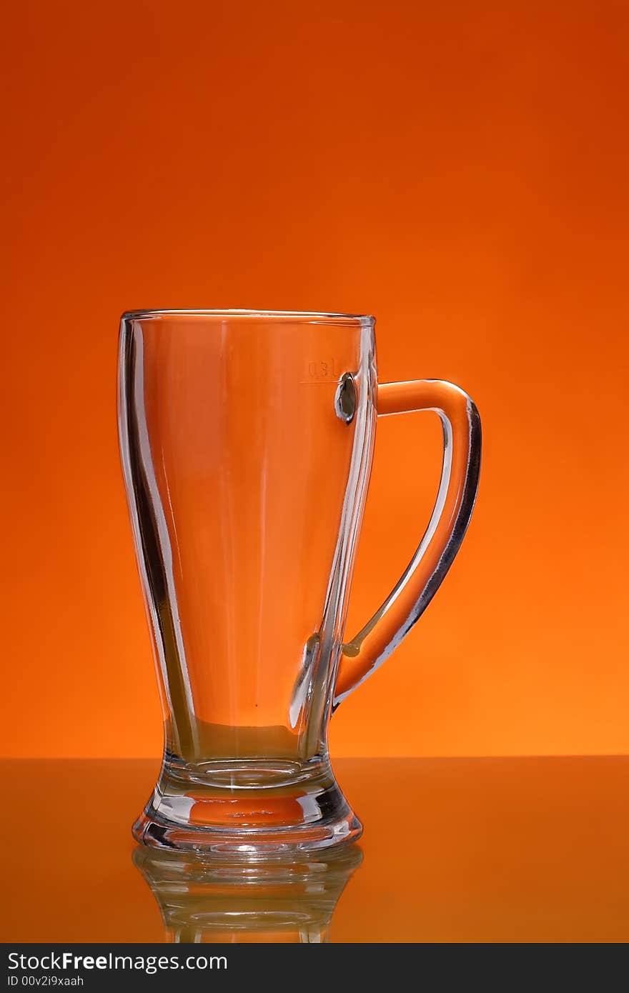 Empty mug over orange background. Empty mug over orange background