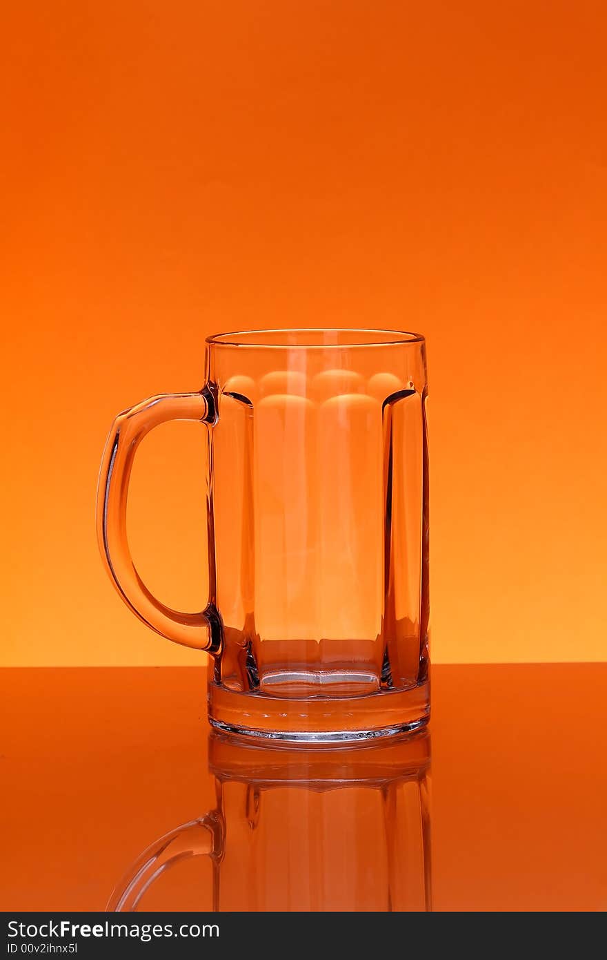 Empty mug over orange background. Empty mug over orange background