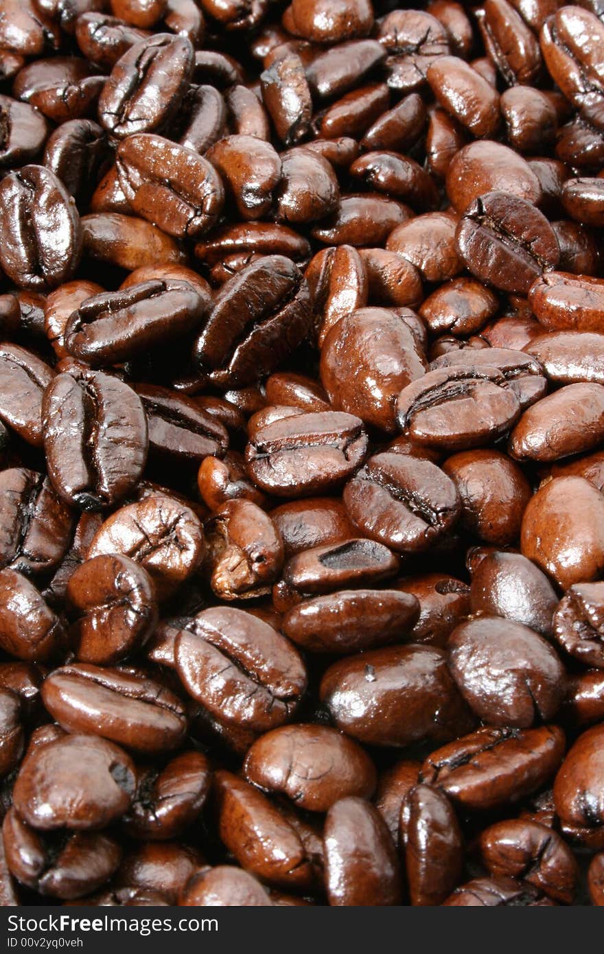 Dark and shiny French Roasted coffee beans background. View more of my coffee image collection.