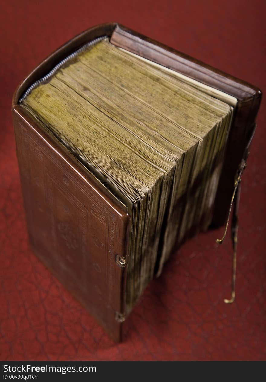 An old book on a red background soft focus. An old book on a red background soft focus