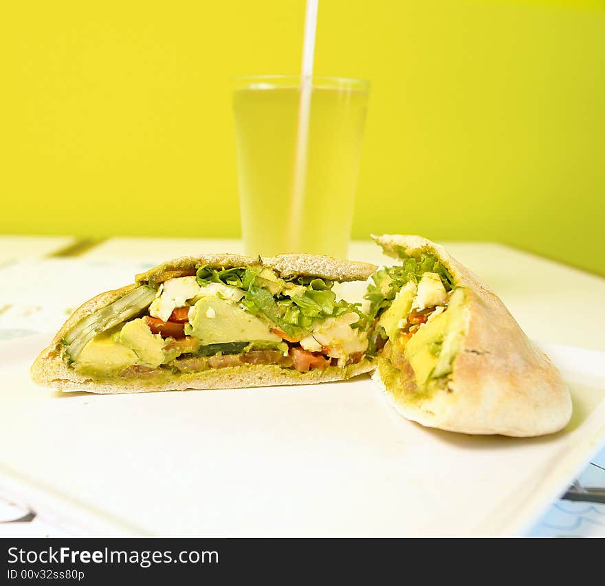 Chicken pita sandwich with lettuce and avocado. Chicken pita sandwich with lettuce and avocado