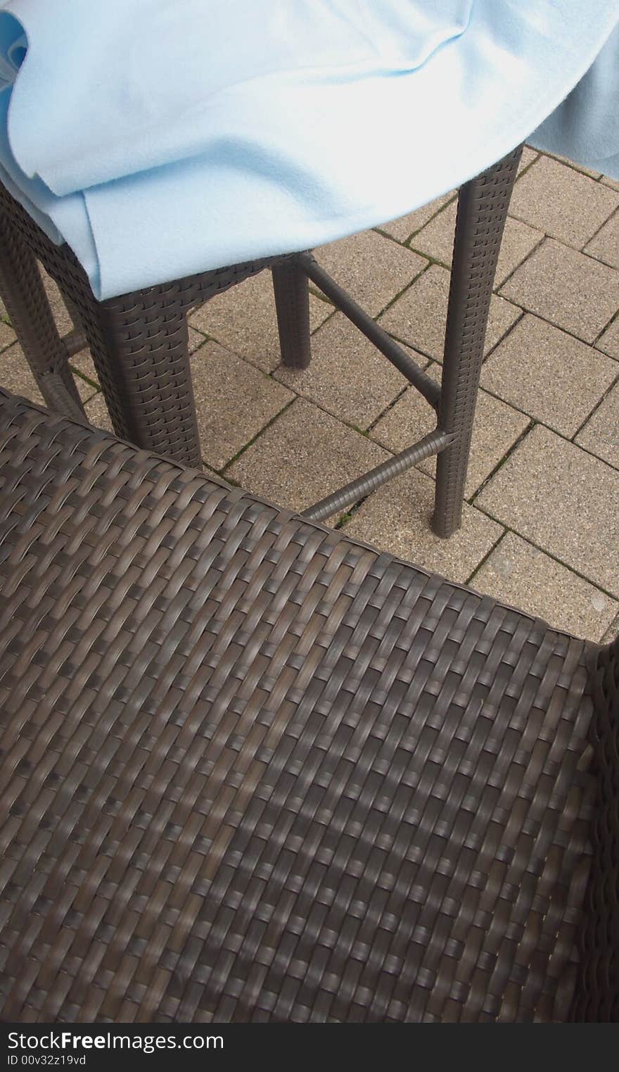 Detail of two high chairs with a blanket. Detail of two high chairs with a blanket