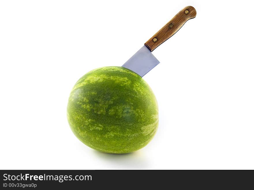 Watermelon with a knife isolated on white