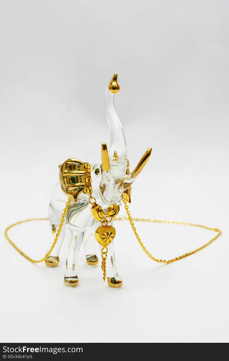 Golden Necklace On Crystal Elephant