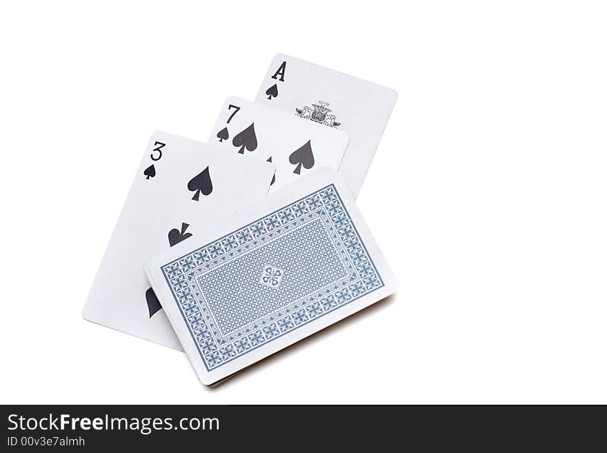 Playing cards laying on a white background