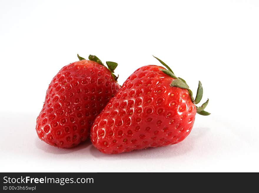 Two strawberry on the neutral background