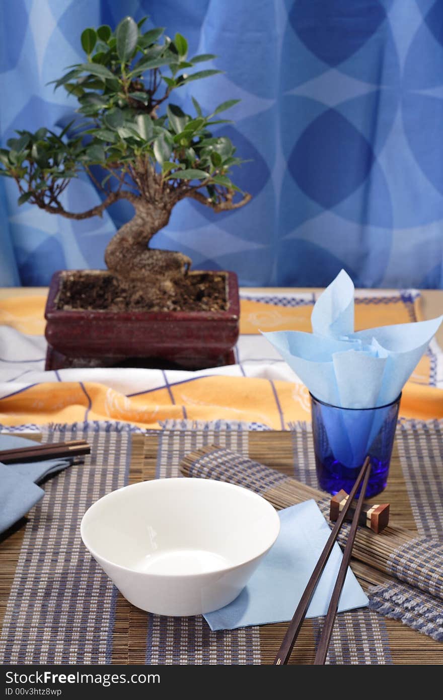 Asian style decorated table, soup bowl in the foreground