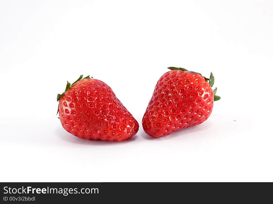 Two strawberry on the neutral background